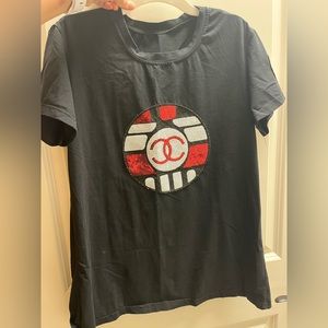 Chanel shirt sequin on the logo.